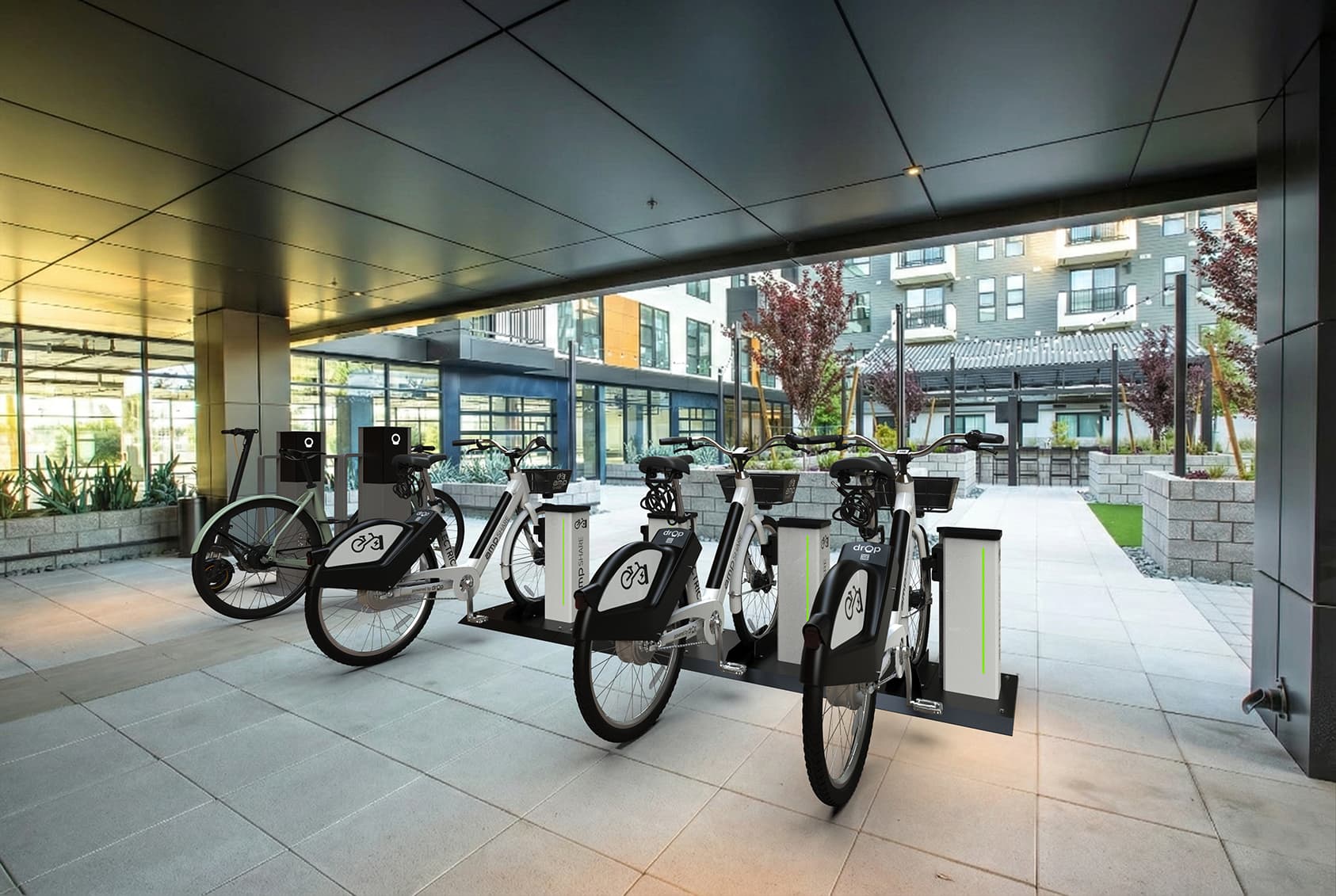 Amp e-bike charging and sharing stations installed on a campus walkway